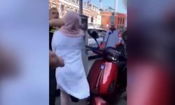 Polis başörtülü kadını tekmeleyip yumrukladı!